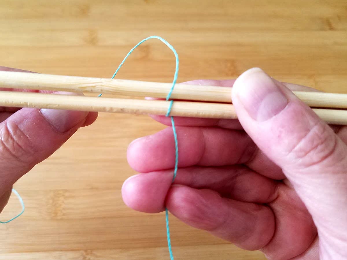 To complete the first pattern repeat, bring the weaving wire over the top and around the back of Wire 2, as shown.