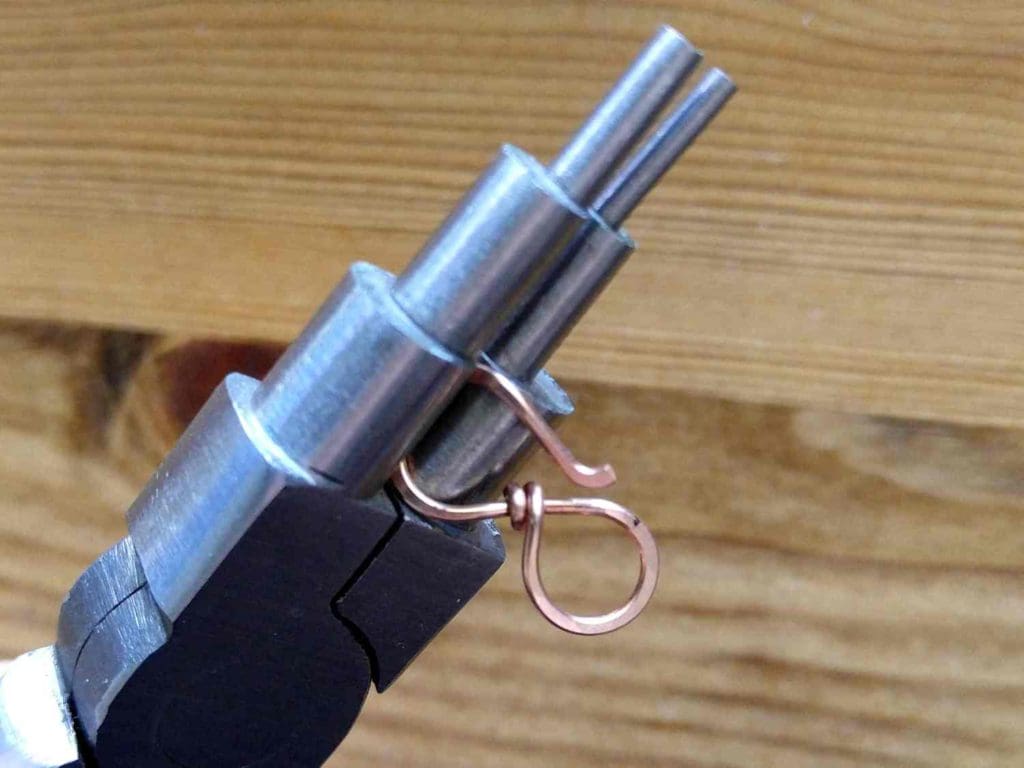 Step 7 - Use your bail-making pliers to softly curve the looped ends and the tip of your hook, as shown. 