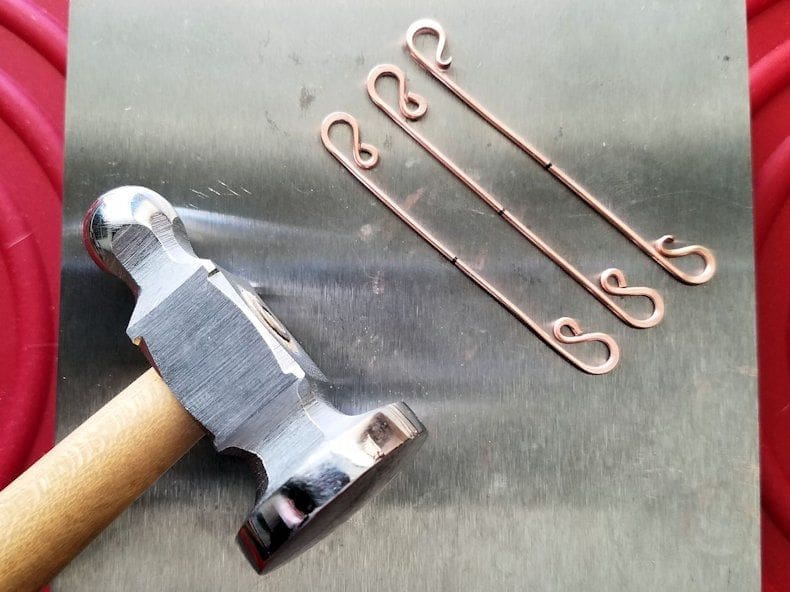 Core Wires Step 11 - Use your hammer and bench block to lightly flatten the rounded ends of your three 18ga core wires. The wires should look like those shown here when done.