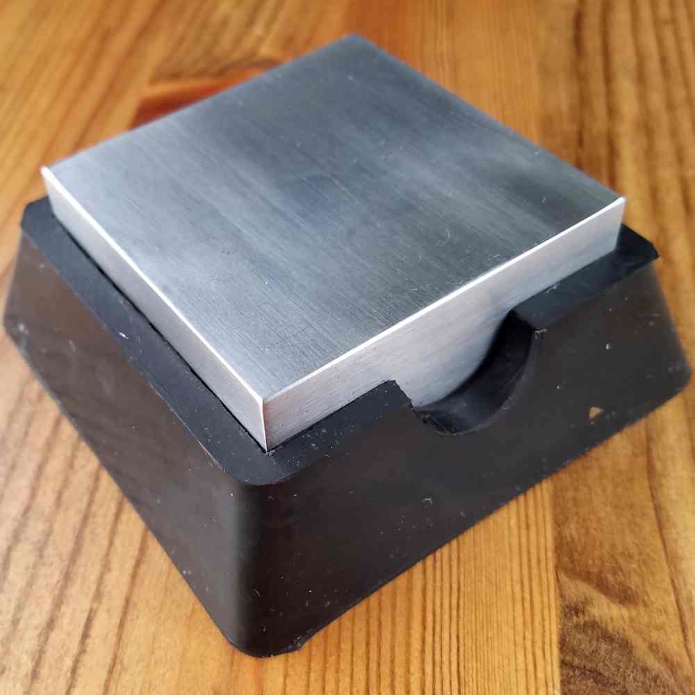 A steel bench block with a rubber base, such as the one pictured here, is very useful if you want to minimize noise. The rubber base absorbs both shock and sound, making this one of the quietest bench blocks I've ever used. 