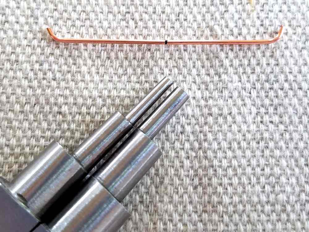 Delicate Bar Pendant, Step 6: Begin shaping Wire 2 with stepped bail-making pliers