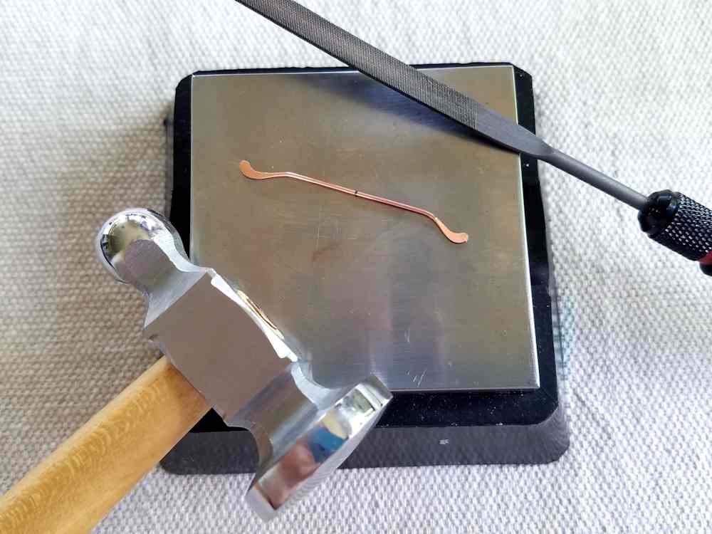 Delicate Bar Pendant, Step 8: Work harden the ends of Wire 2 to lock the curves into place