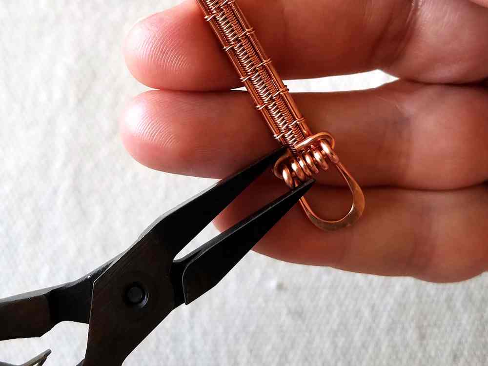 Step 34 - Permanently secure the loop component of the clasp to the band. 