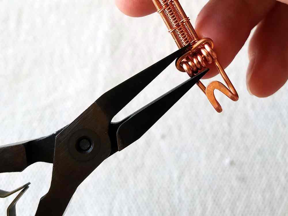 Step 35 - Secure the hook component to the other end of the band just as you secured the loop component. 