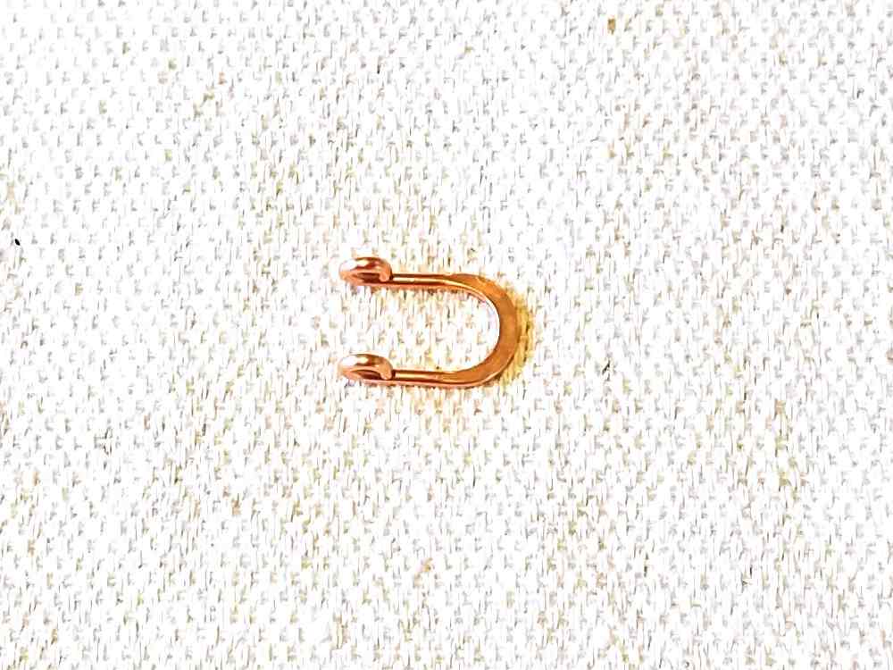 Finish forming the loop component by making small, tight loops on both arms with the 2mm step of your stepped bail-making pliers.