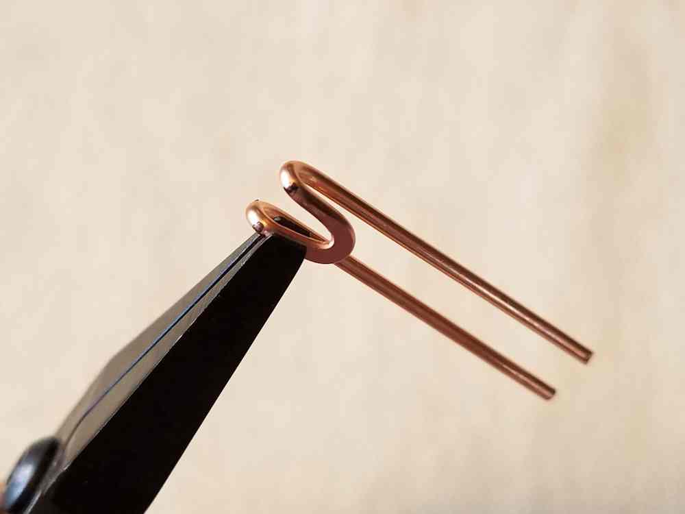 Finish forming the hook on the other arm, using flat nose pliers.