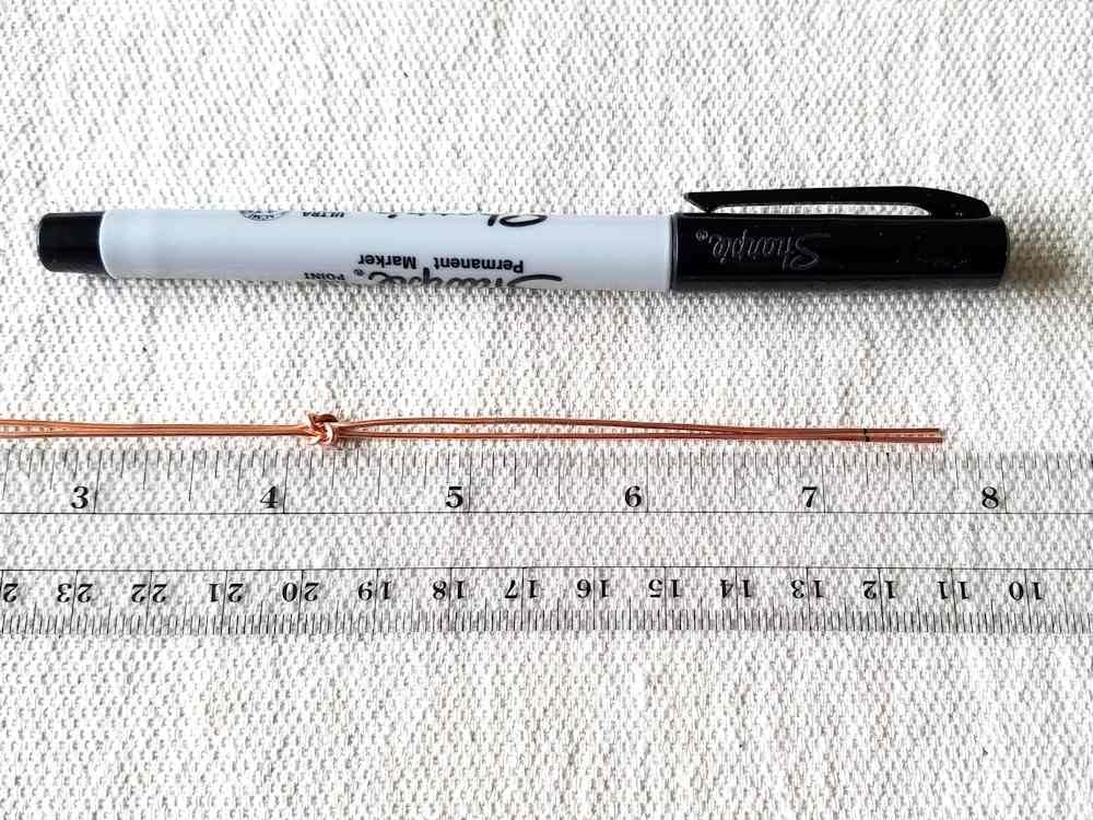 Step 8 - Mark the core wires 3/8-inch from both ends. This is where you will break your weave later on in the tutorial.