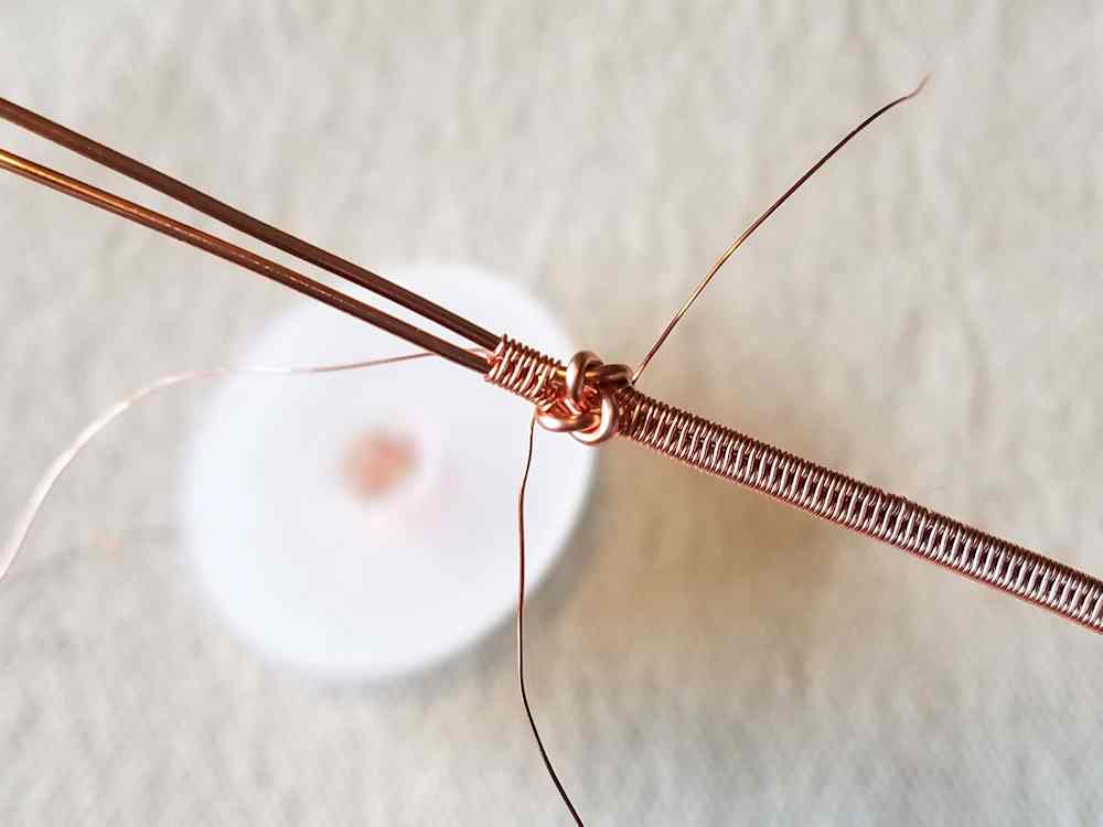 Flip the knotted core wires over and repeat Step 20 on the other side of the knot.