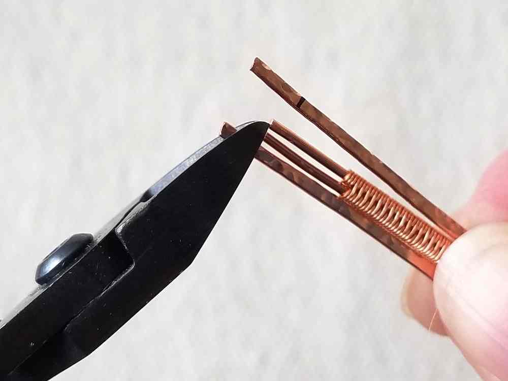 Trim the two textured bangle wires to length.