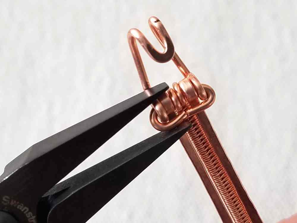 Repeat Steps 35 and 36 to secure the hook to the other end of the bangles.