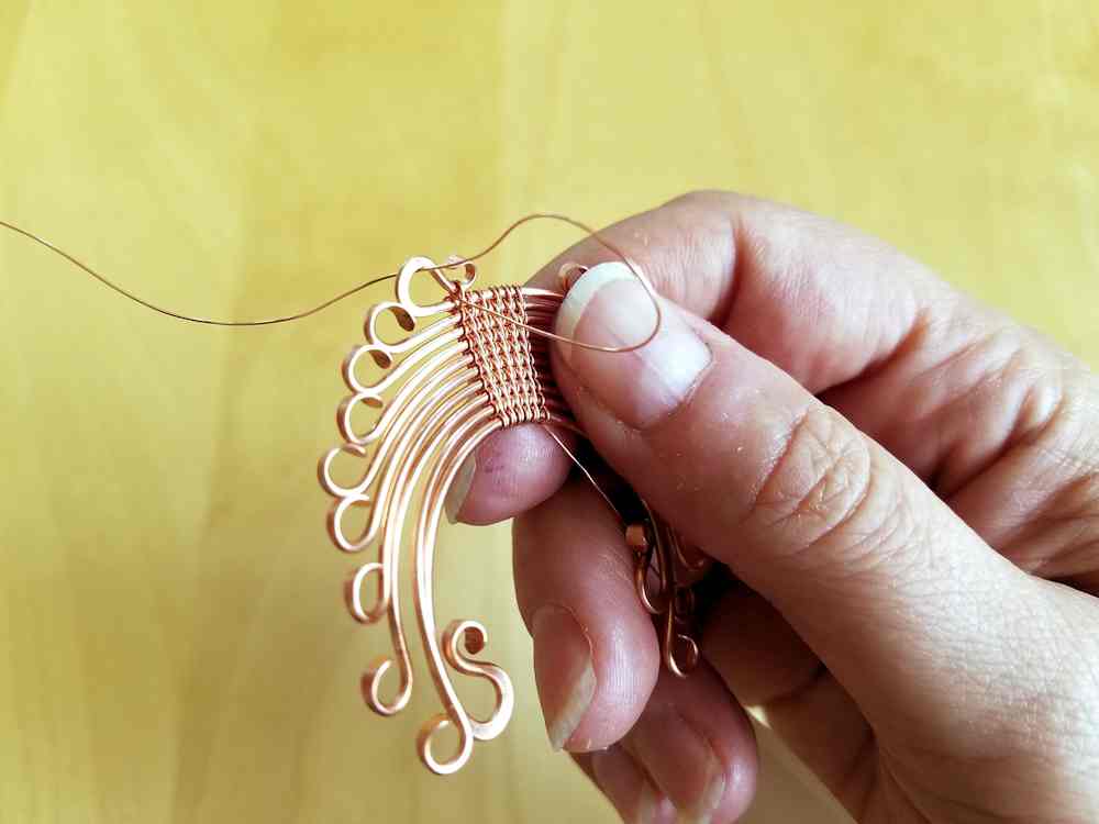Door 44 Studios Ancestor Pendant Tutorial: Step 20, continue weaving the first half of the headdress until you reach the ends of wires 9 and 10.