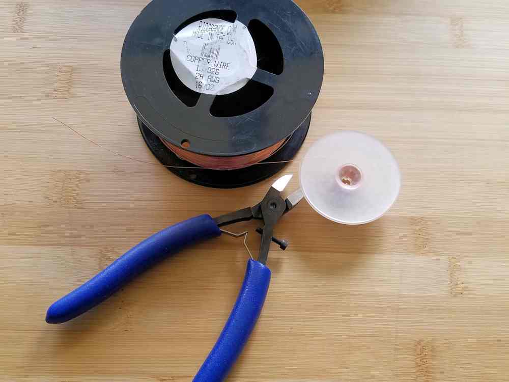 Step 12 - Prepare your weaving wire by winding several feet of wire onto a plastic bobbin.