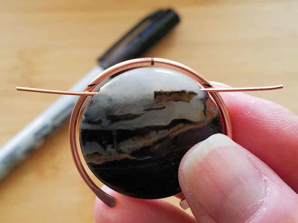 Step 13 - Feed a scrap piece of wire through your focal bead and use the wire to determine where the bead will be attached to Wire 1. 
