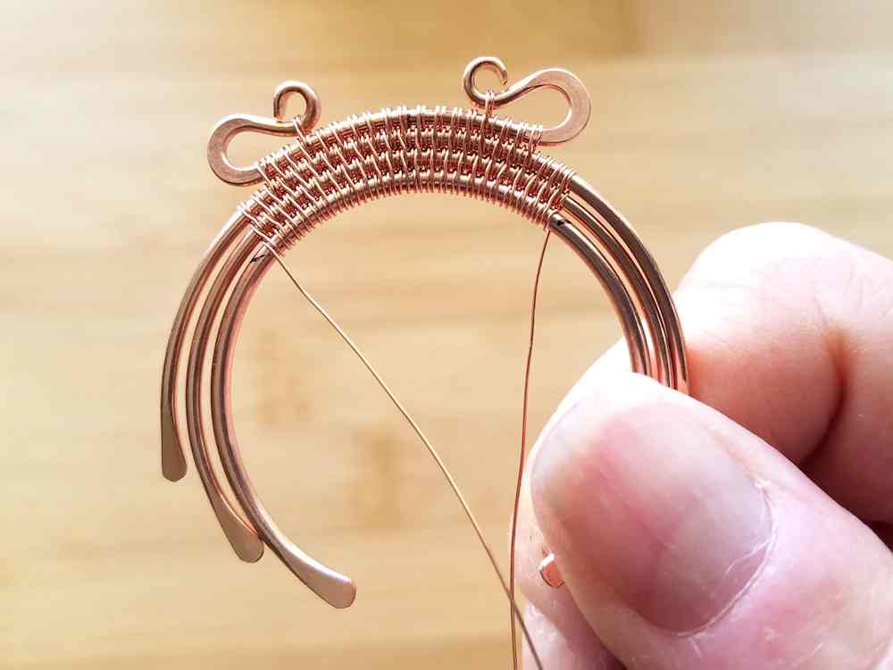 Step 15 - Flip your bead frame over and continue the weave in the other direction. Stop at the mark indicating the bead's hole position.