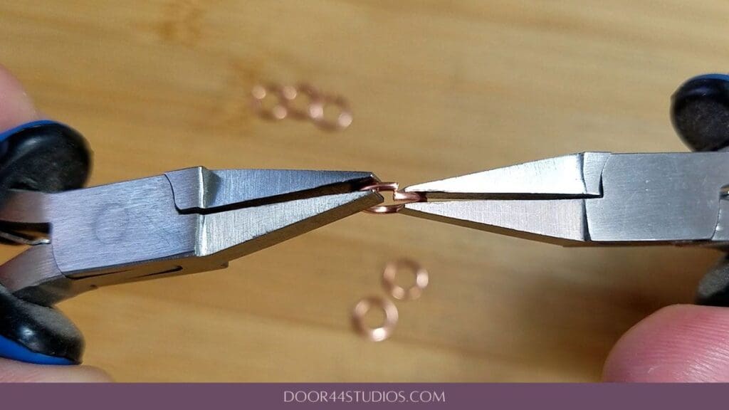Creating tension in a jump ring by pushing the ends just slightly past the cut line