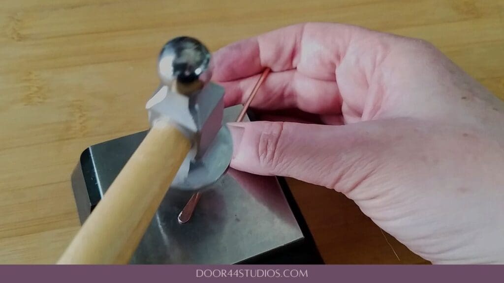Paddling the ends of the wire for the circlet part of the hammered shawl pin