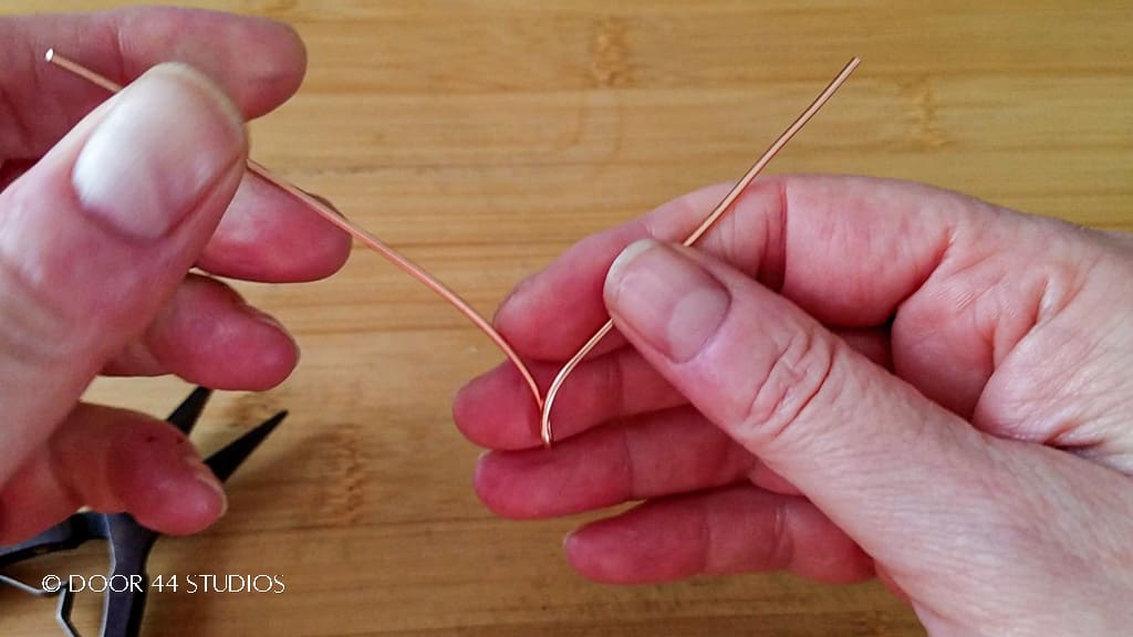 Prepping the wire before forming the first curve of the quick and easy wire heart pendant