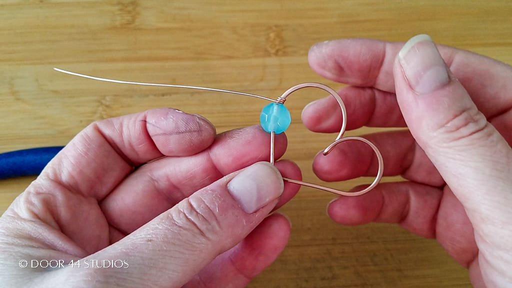 This image shows the core wire for the coiled coil anchored to the heart-shaped frame