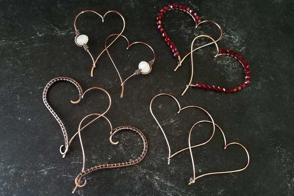 The simple heart hoop earrings along with three simple variations that can be easily made using this basic earring design