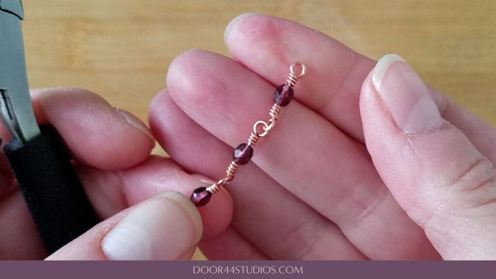 Step 7 - Finish your connector as instructed. Continue making as many symmetrical wrapped loop connectors as needed. Your finished chain should be similar to the one shown here.